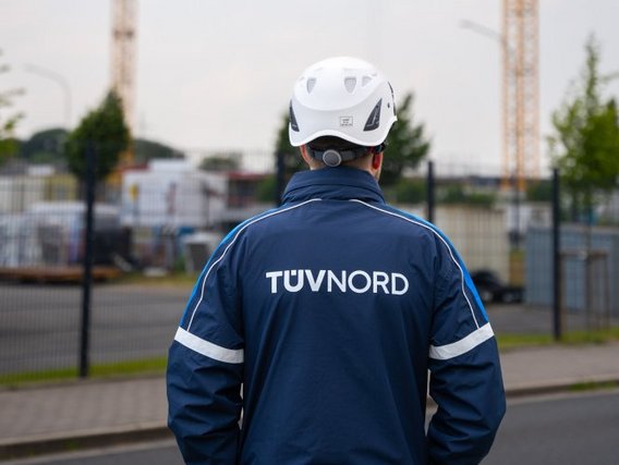 TÜV inspector looks at construction site